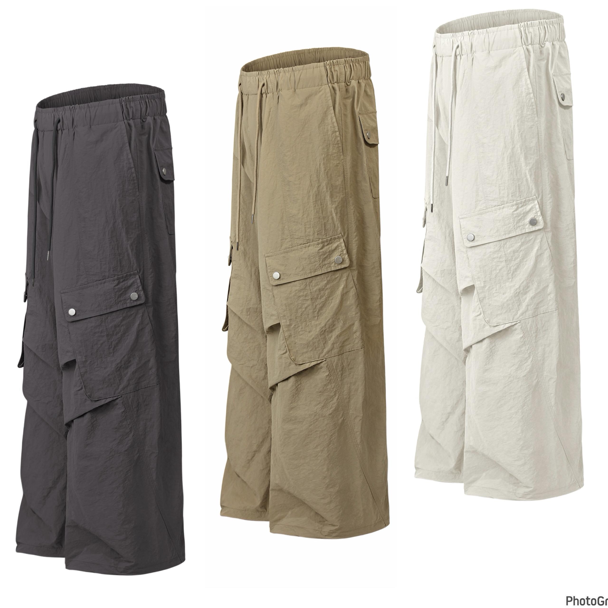 Wide-Leg Parachute Cargo Pants with Snap Pockets — image 1
